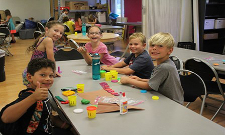 Kids playing with Play-Doh Triathlon